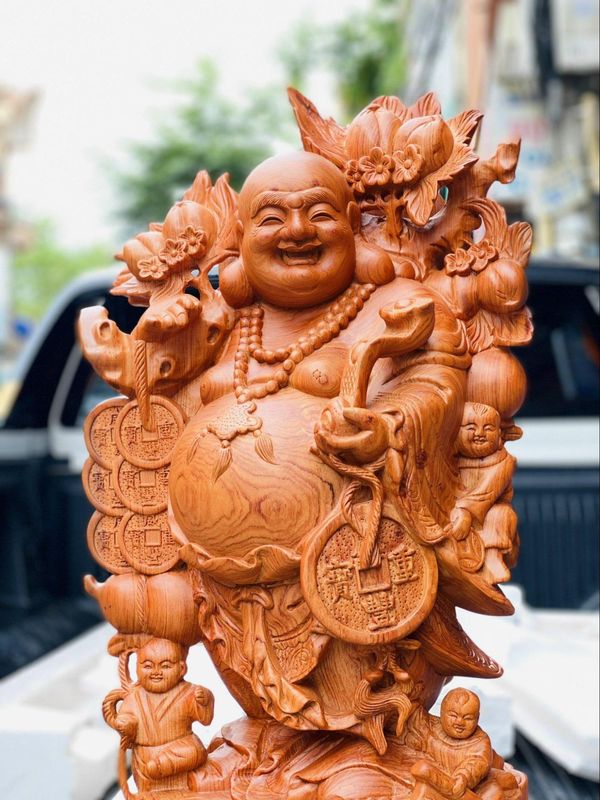 Mua tượng Di Lặc vác cành đào uy tín tại Hàm Rồng Việt
